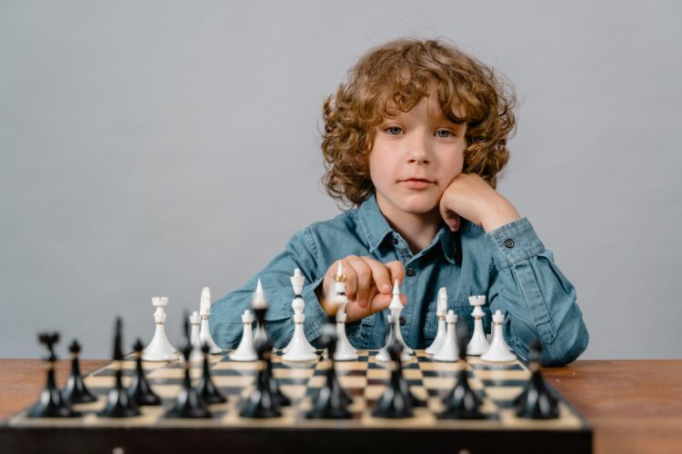 a smart boy playing chess